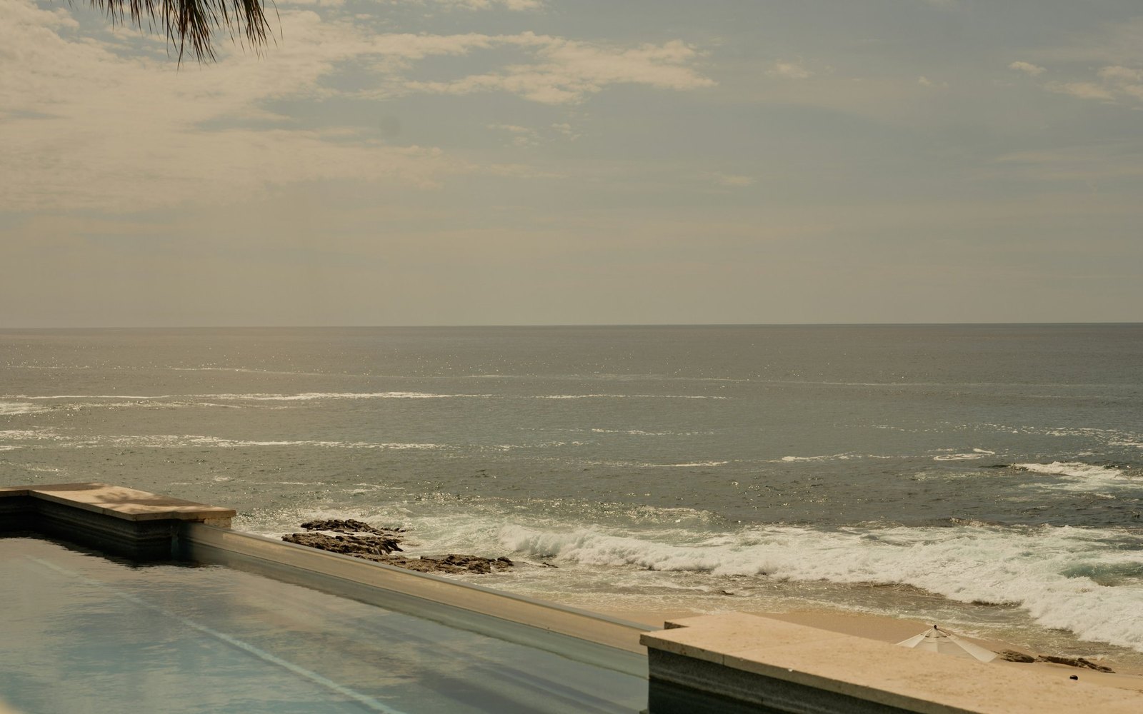 Just past the pool: the Sea of Cortez, with the steep drop and the shore break clearly visible