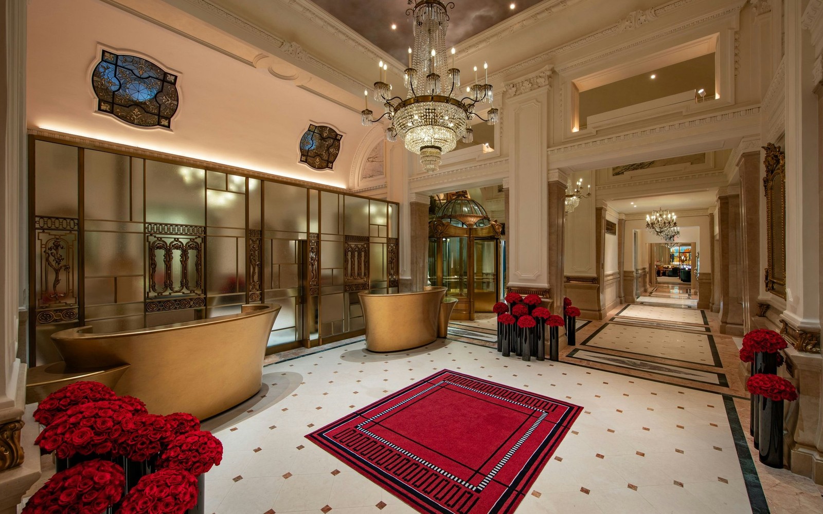 The lobby in season, dressed with red carpet and banked red flowers