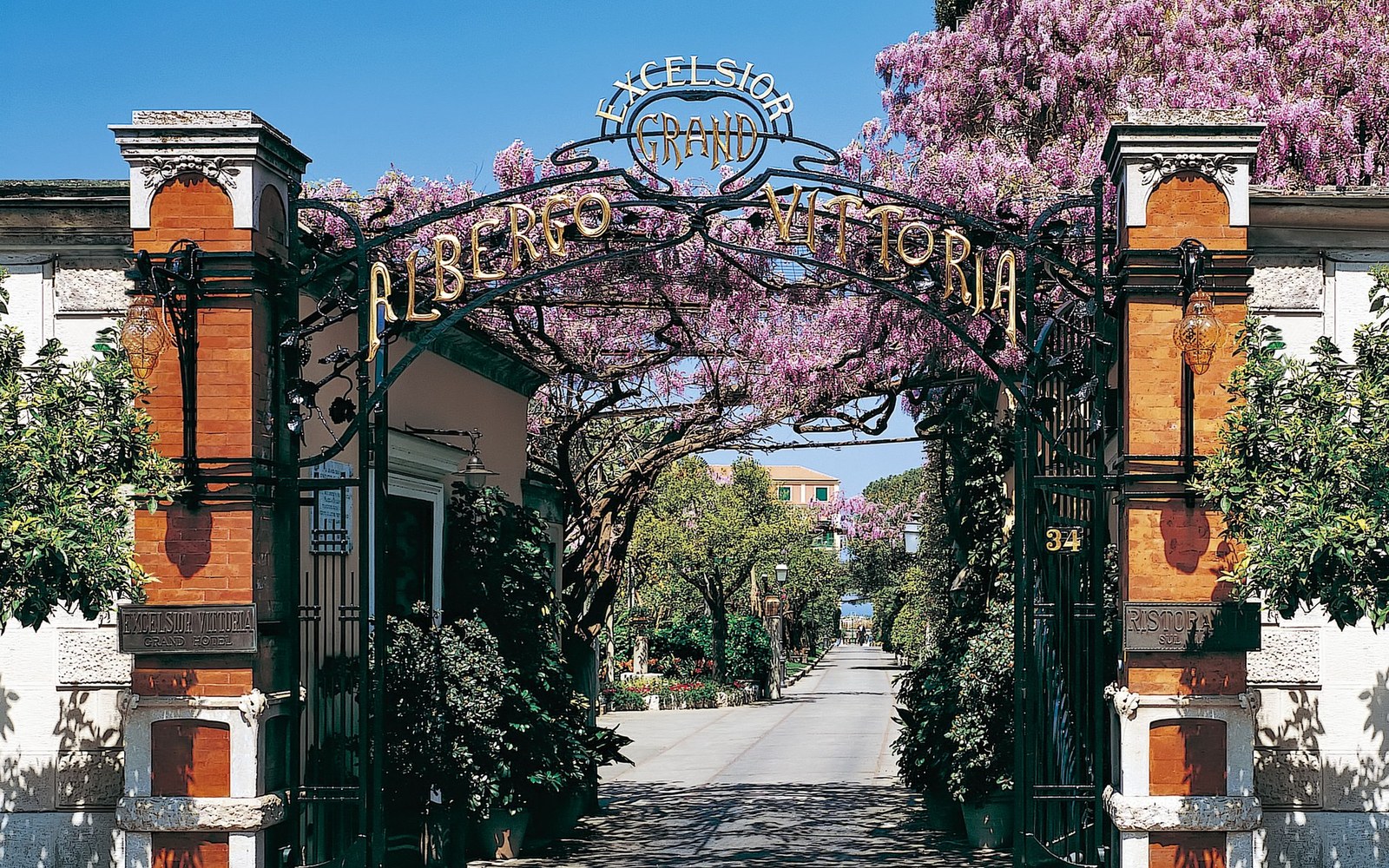 The gate carrying the hotel name, and the drive through the five-acre private park