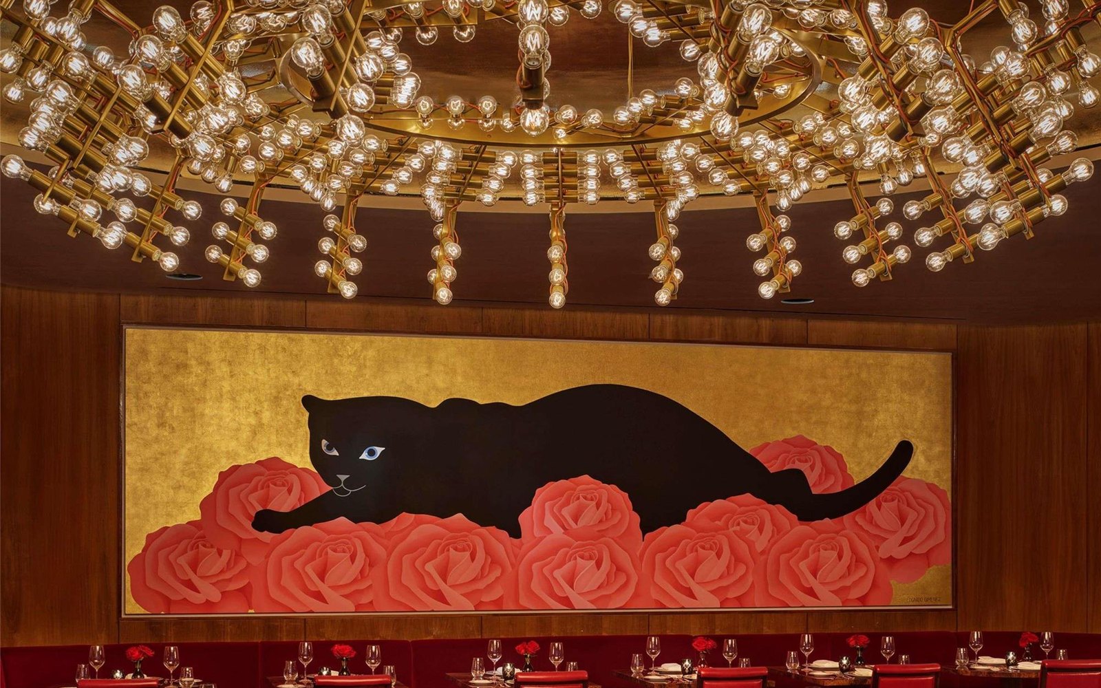 The bar level: a dome of gold bulbs, and the panther-on-roses painting that anchors the room