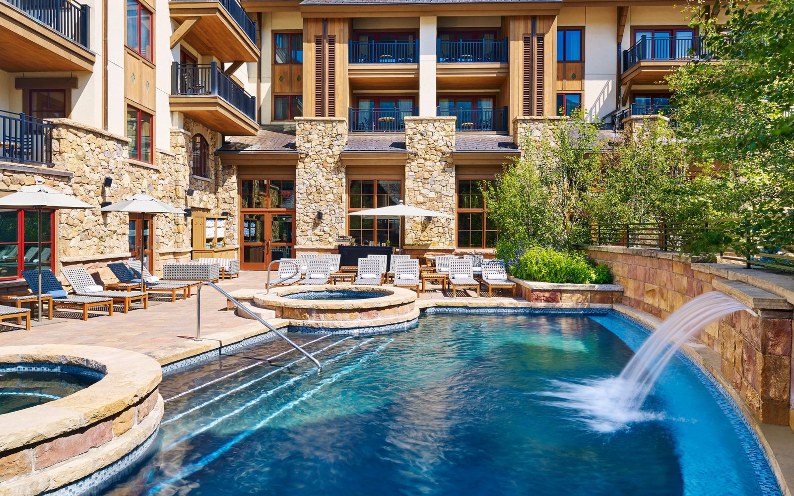 The year-round outdoor pool and hot tubs. Official photograph, taken outside the ski season